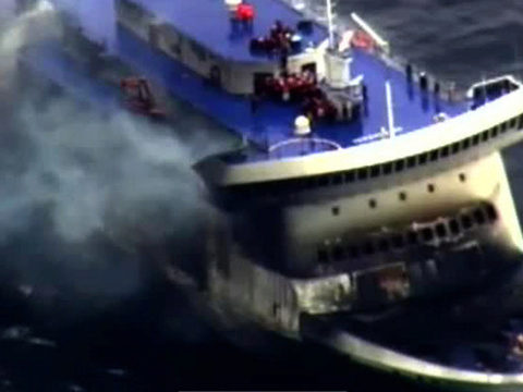 One dead in Italian ferry blaze, hundreds await rescue